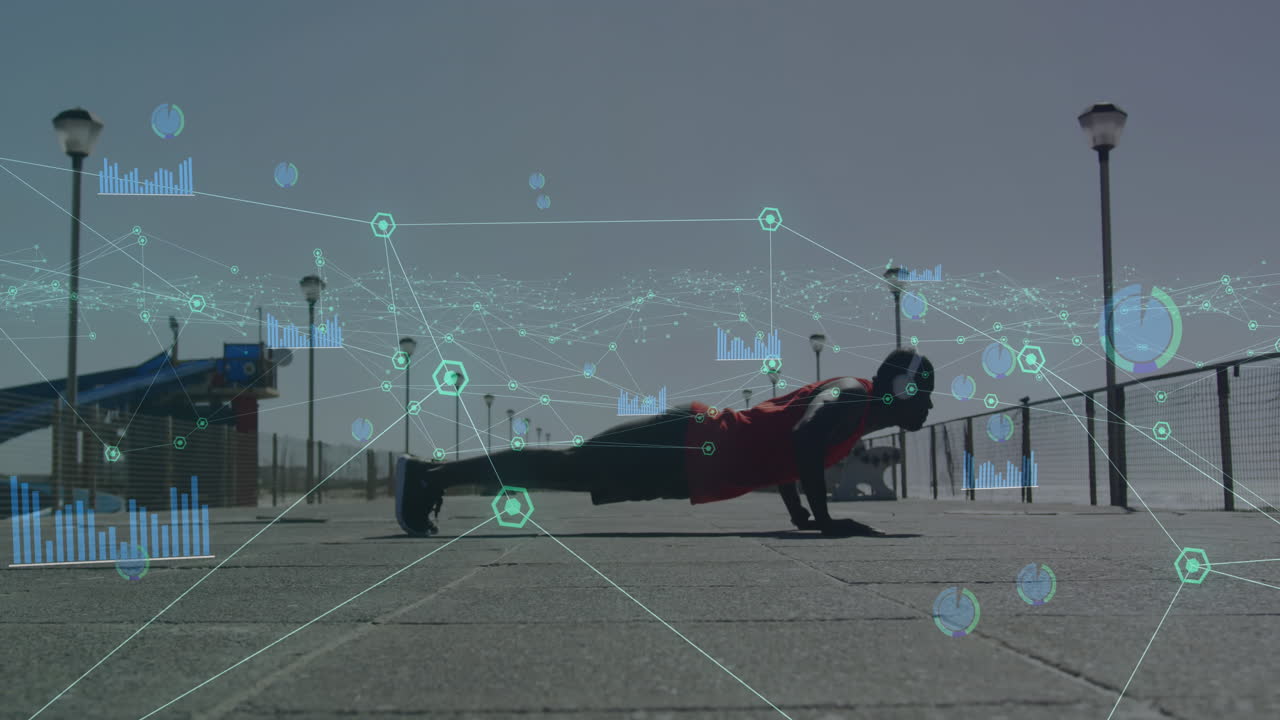 기술은 밖에서 푸시업하는 건강한 아프리카계 미국인과 연결됩니다.