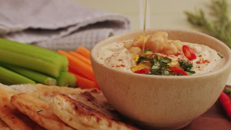 hummus with pita bread and vegetables
