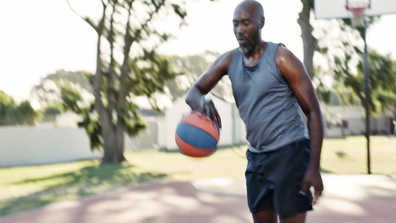 Man playing basketball outdoors