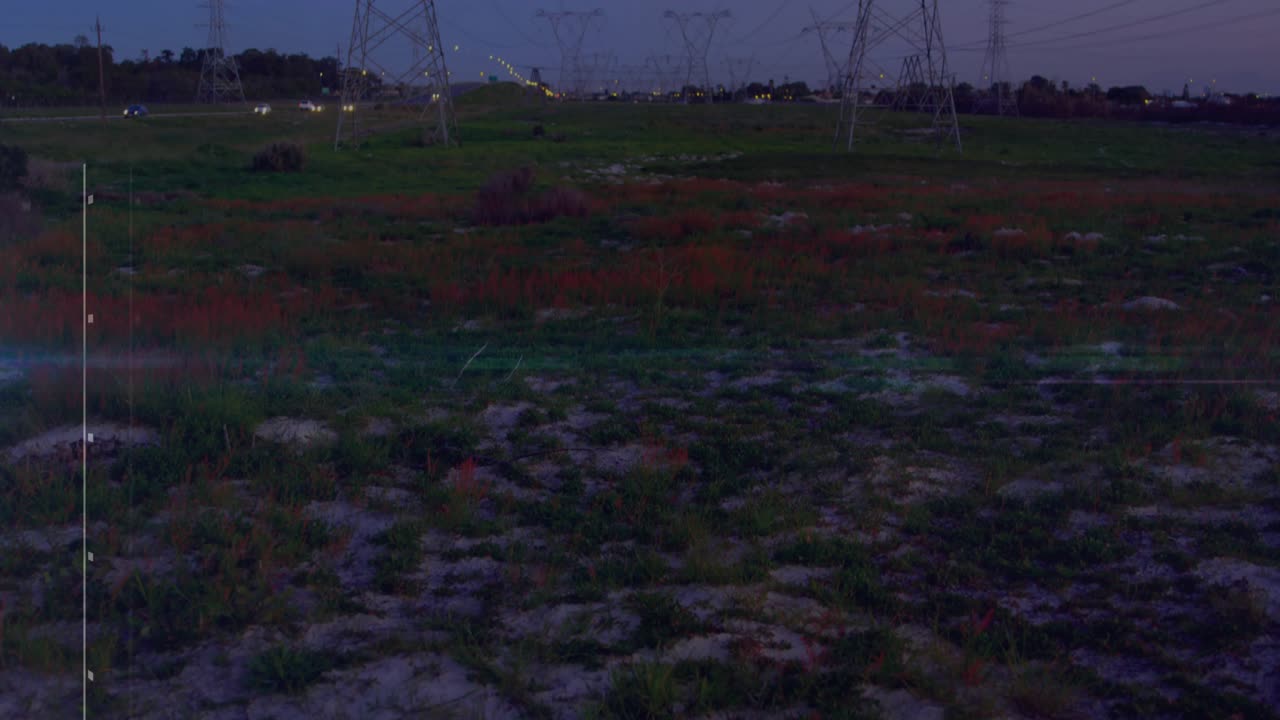 Power pylons holding as blue horizon flare emerging, animating faint blocks and waves showing data