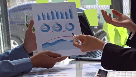 businessman working on the financial graph with a business team meeting and discussing project plans. talk in the meeting room professional investors working on business projects.