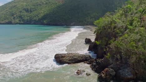 Tilt-up-shot-of-El-Valle-beach-in-Samana,-Dominican-Republic--drone-view