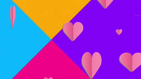 animación de múltiples iconos de corazón sobre triángulos multicolores contra un fondo blanco