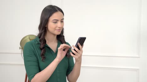 Indian-woman-scrolling-and-using-phone