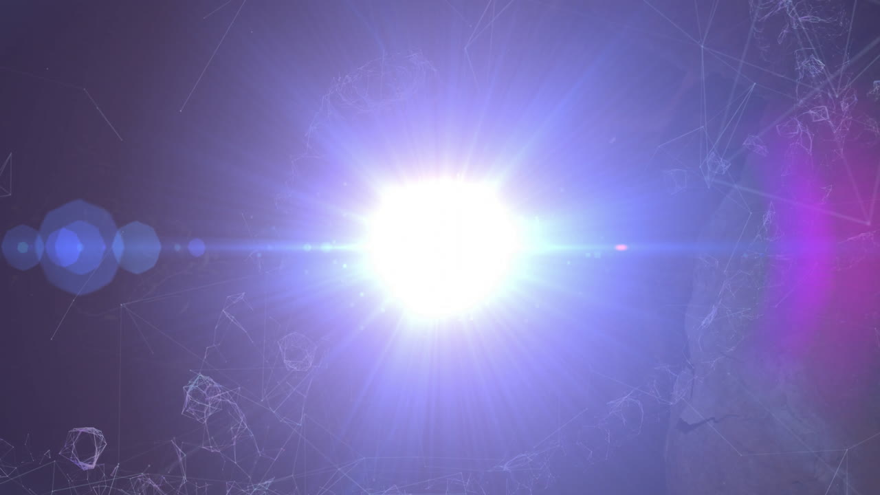 Designers interacting with digital tech scene, featuring glowing light orb and polygon lines