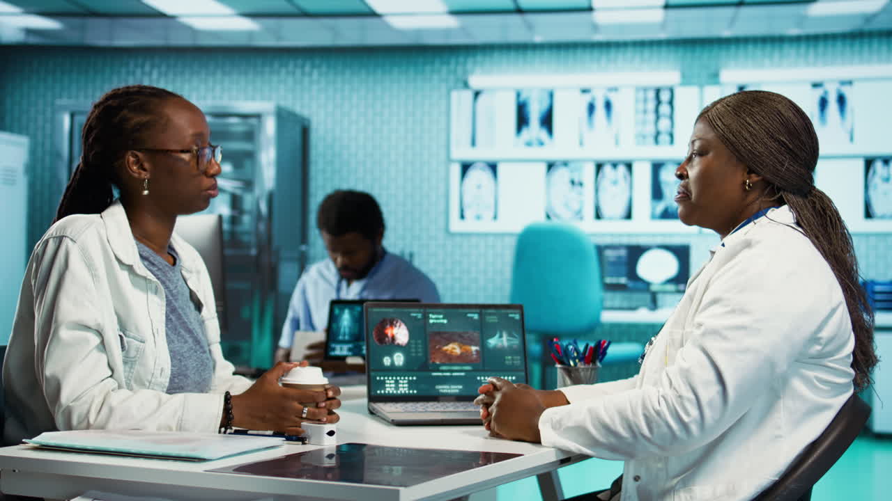 Female healthcare professional consulting a young girl patient