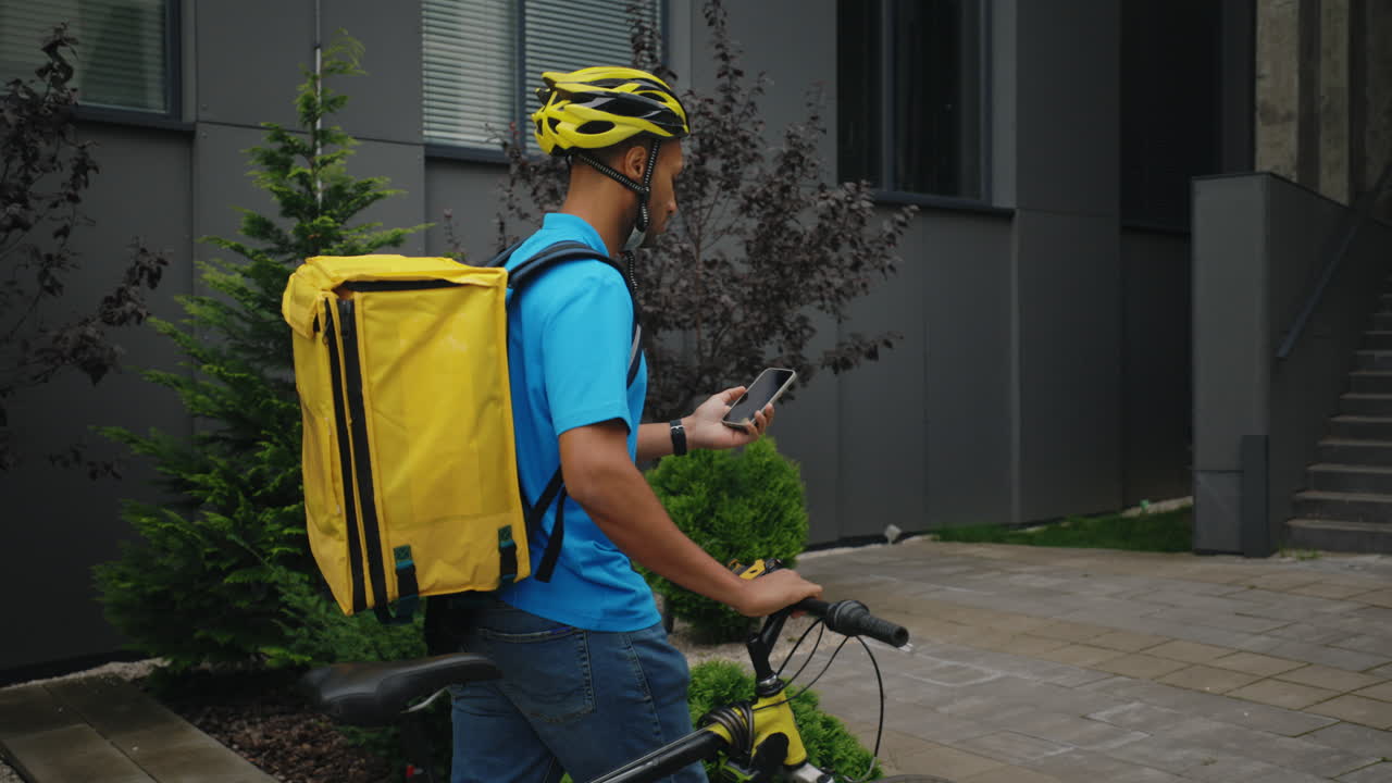 Delivery Person with Bike and Backpack