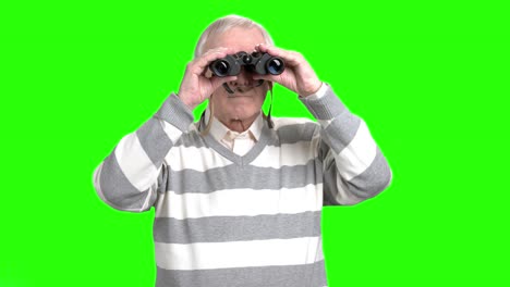 senior man using binoculars.