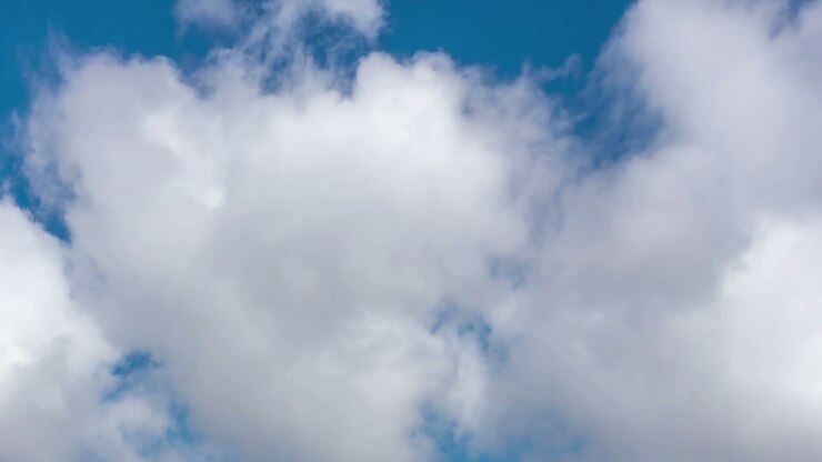 Time lapse of moving clouds in blue sky