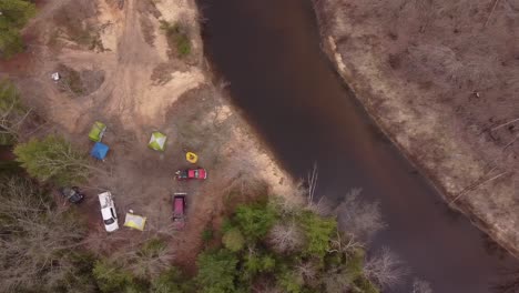 Off-Road-Vehicles-Park-At-The-Riverside-Of-Muskegon-River-In-Leota,-Michigan