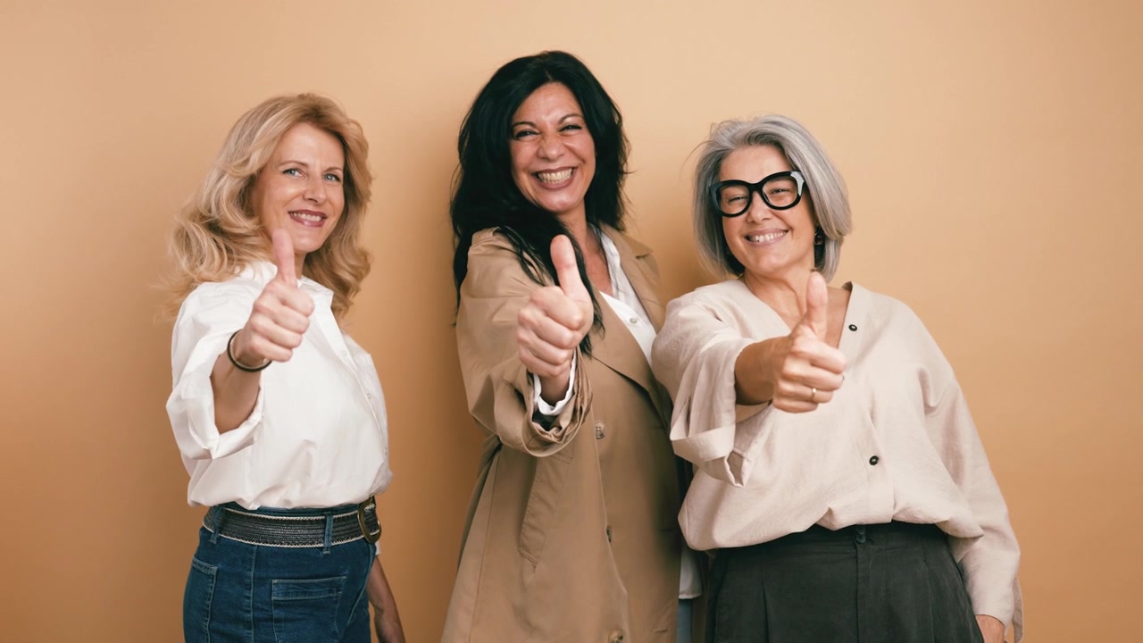 Three Mature Women Giving Thumbs Up Together