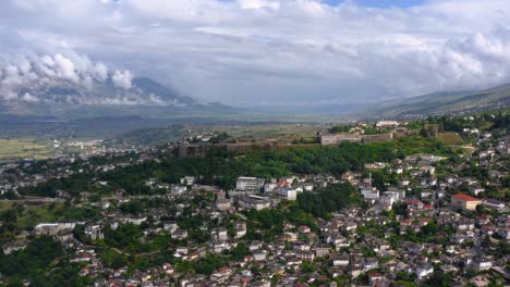 Birds-eye-view-of-mountainous-landscape-with-town-in-the-valley