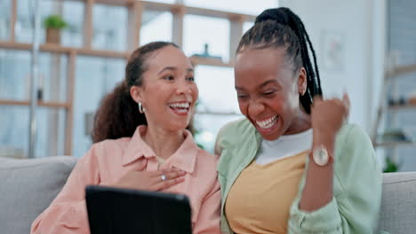 women, tablet and celebrate success on home sofa