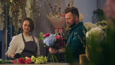 two professional florists discussing work process