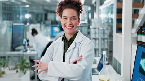 portrait of a smiling scientist in a modern laboratory