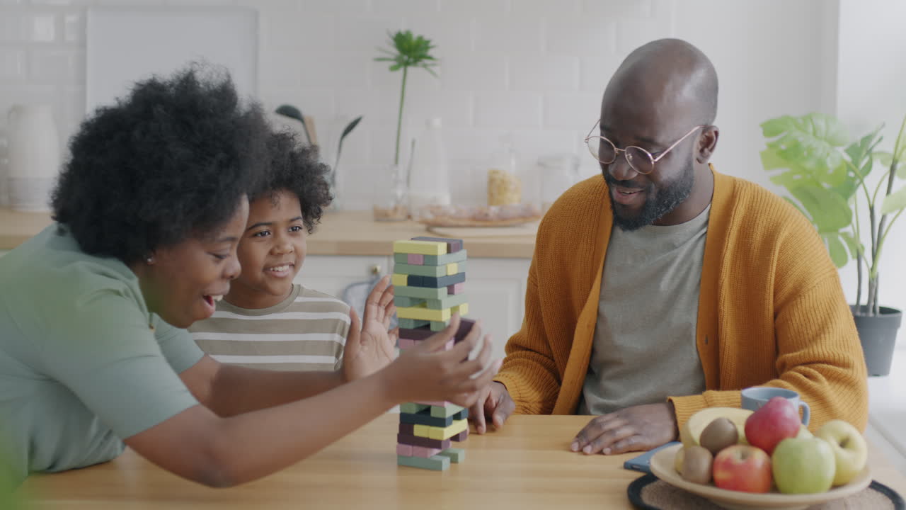 Family Playing Stacking Blocks Game