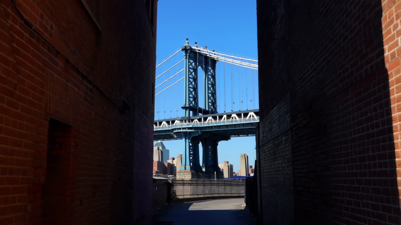 Manhattan Bridge framed by brick buildings in Brooklyn