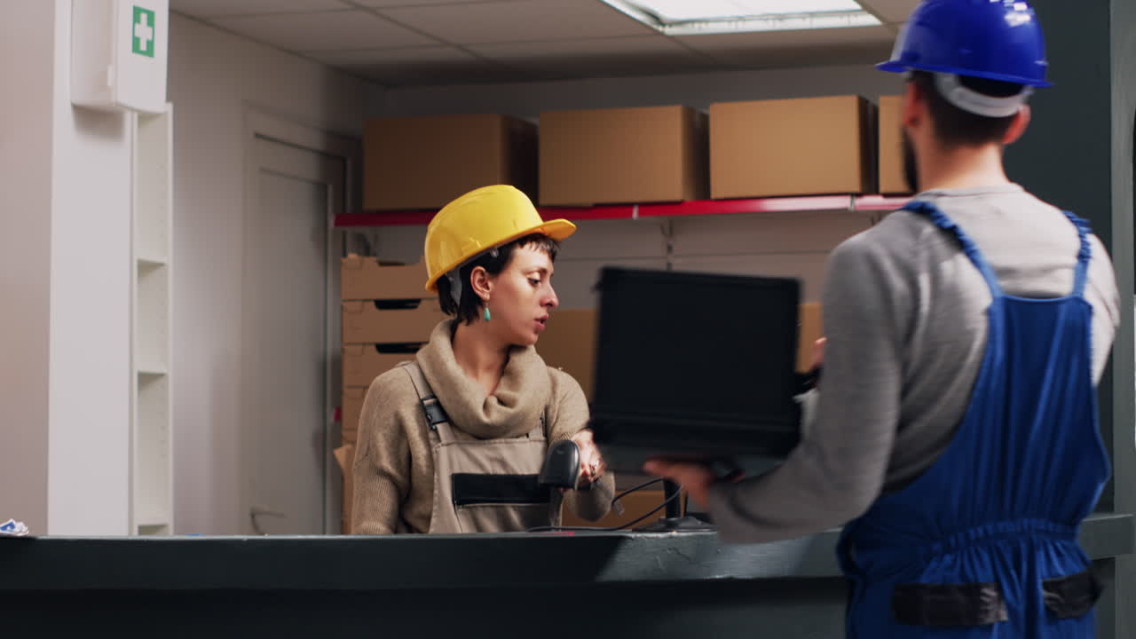 Warehouse workers scanning boxes