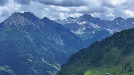 wallpaper scenery of mountains and tree covered austrian countryside