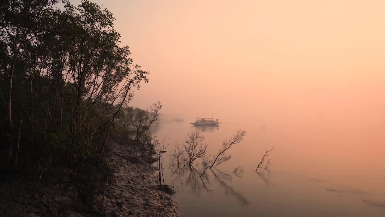 Tourist ship in sea of Sunderban Islands and Mangrove forest in West Bengal during Sunrise time
