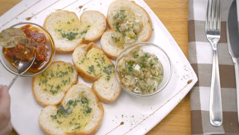 bread toasts with pickled peppers and aubergine, mediterranean