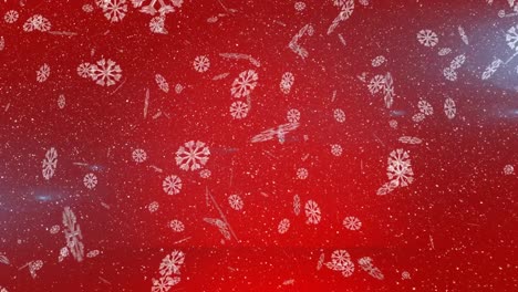 Snow-falling-and-snowflakes-icons-against-spot-of-light-on-red-background