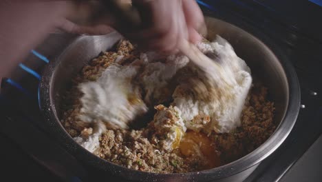 mixing low fat cheese and eggs into vegetable mixture