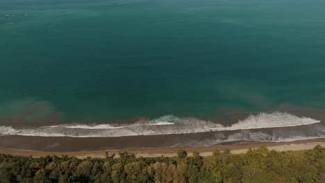 Waves-On-The-Sandy-Shoreline-Of-Uvita-Beach-Whaletail-In-Costa-Rica,-Central-America