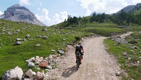 solo bikepacking explores remote dolomite wilderness, majestic peaks, clear sky