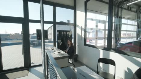 car service manager working at desk in office