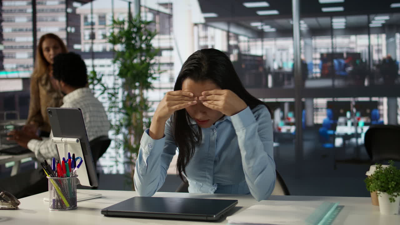 Professional Woman Working on Laptop in Modern Office