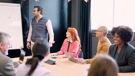 smiling group of colleagues in a meeting room