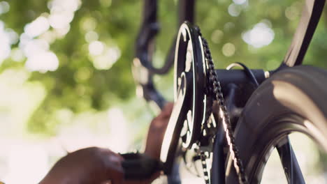 Couple-working-in-yard-on-bicycle-parts