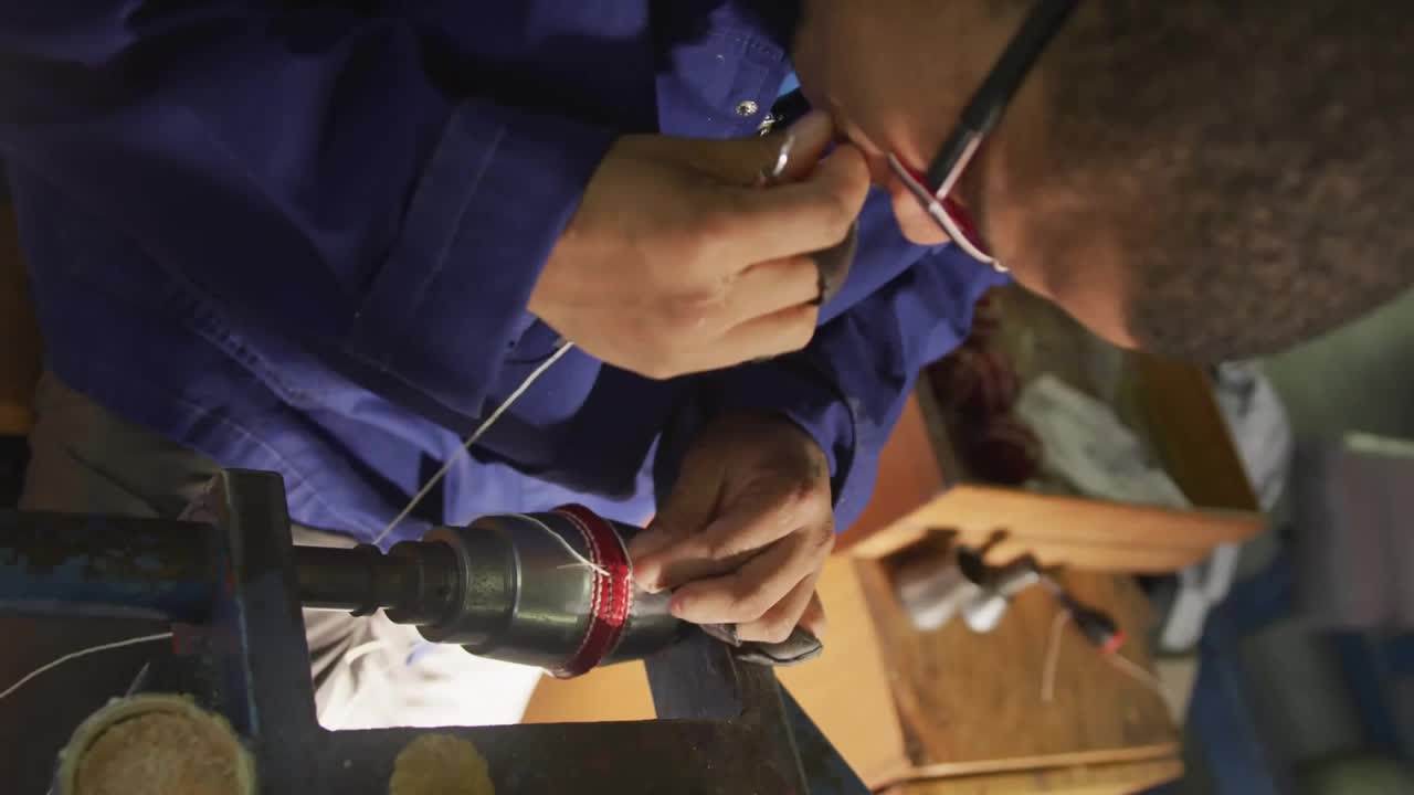 Woodworking craftsman securing blank in lathe for shaving through cascading emojis smoothing finish
