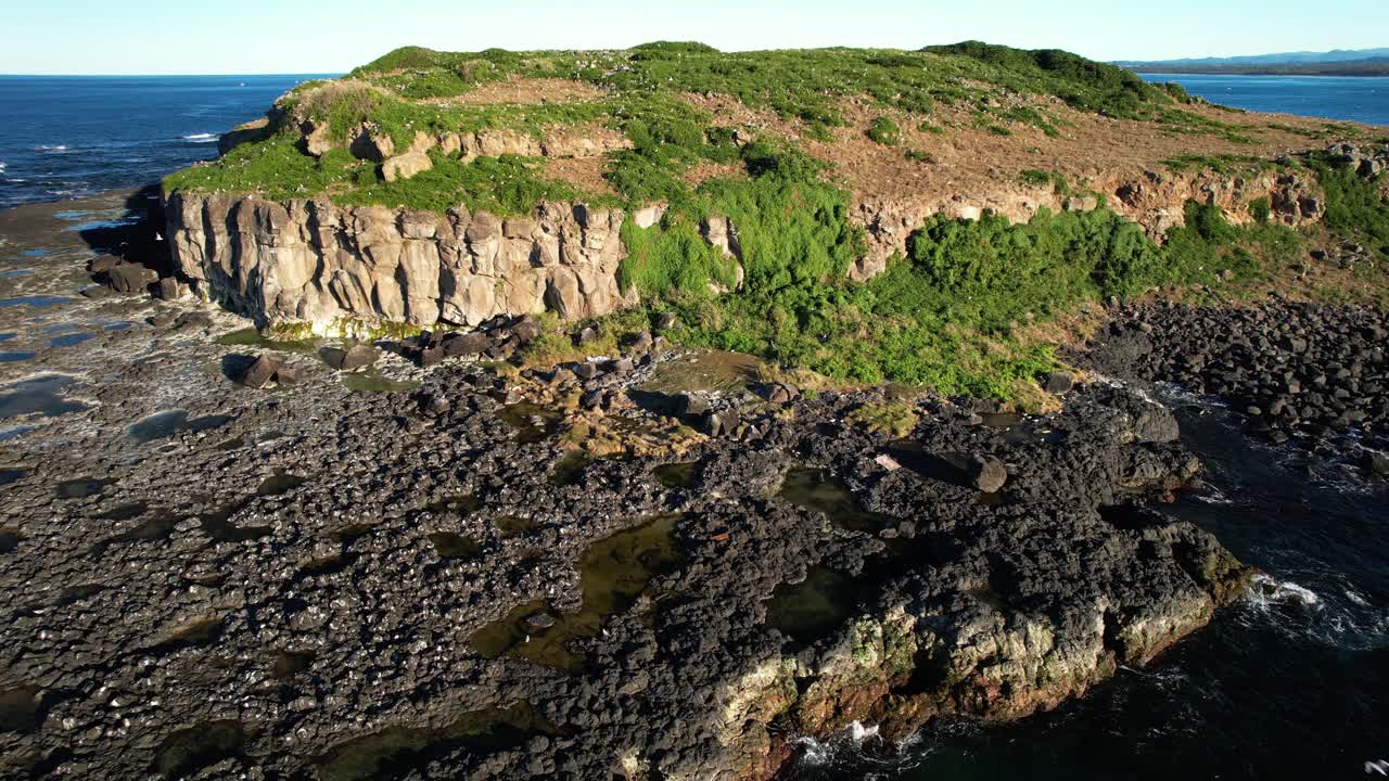 Rugged Landscape Of Cook Island In NSW, Australia - Drone Shot