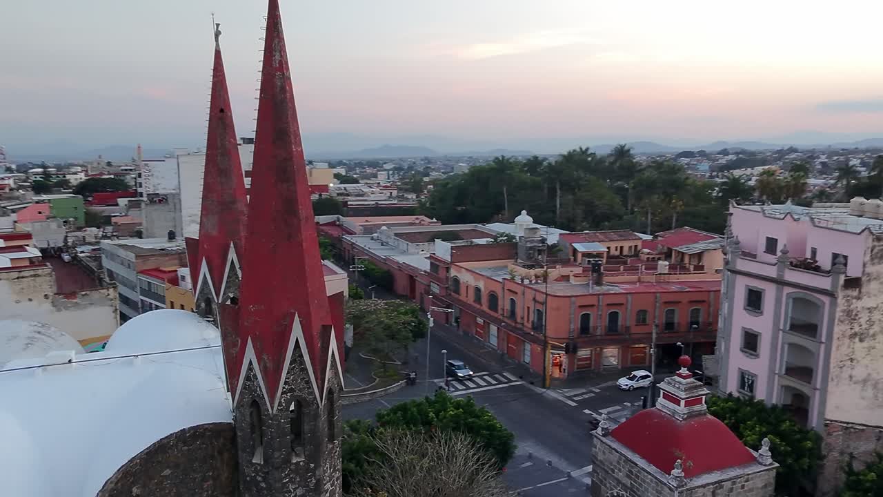 Iglesia del calvario and colonial buildings in cuernavaca at sunset, aerial view