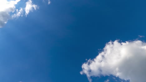 sun shining brightly on the fluffy white clouds. wonderful timelapse of soft airy clouds building in the sky.