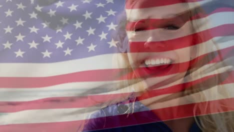 Animation-of-happy-caucasian-woman-by-sea-over-flag-of-usa