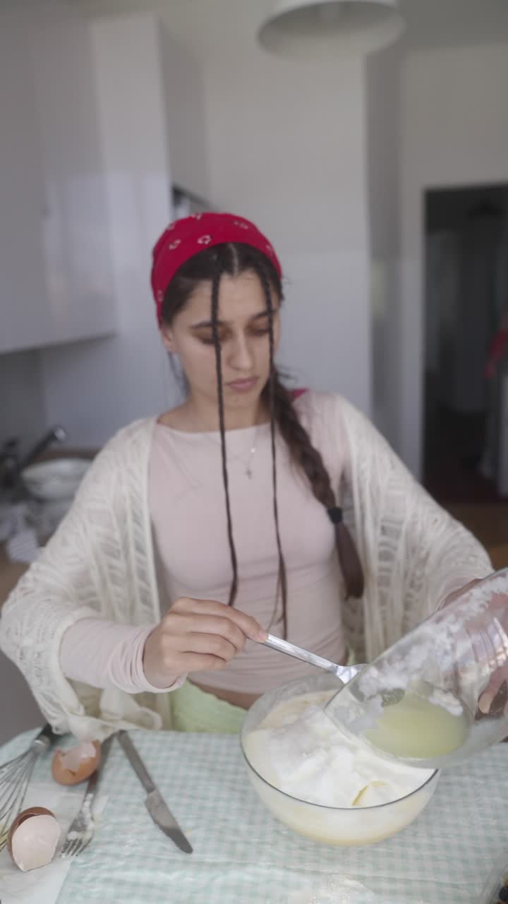 Teenage Girl Baking in Kitchen