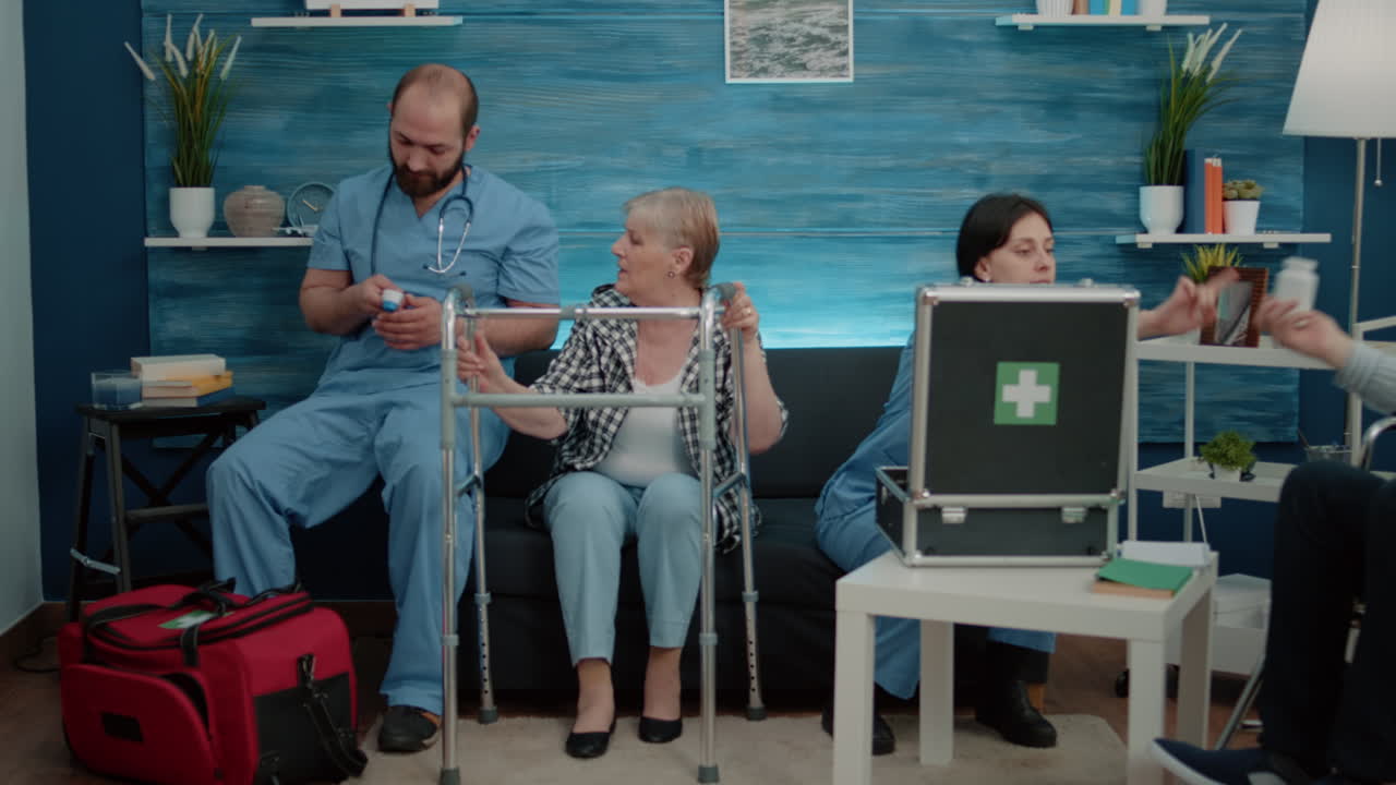 Medical team helping senior people in nursing home