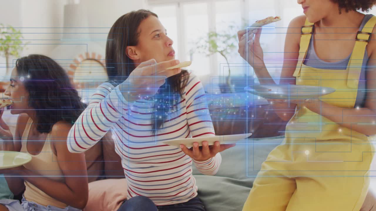 Center woman lifting pizza slice, offering toward friend on sofa to share, technology HUD animating