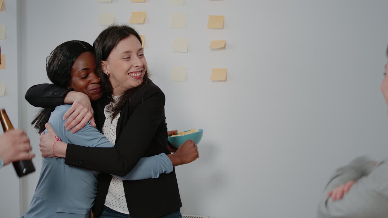 Close up of cheerful women enoying foosball game at table
