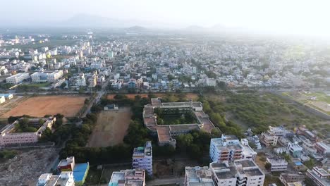 aerial pan right over the city of chikmagalur on a sunny day