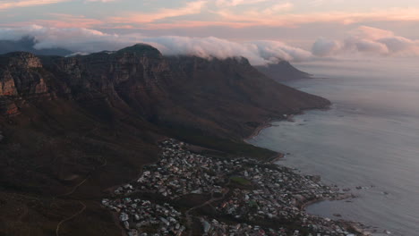 aerial of the twelve apostles and camps bay with sunset in cape town