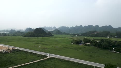 panoramic view of rural vietnamese landscape with rice paddies and mountains