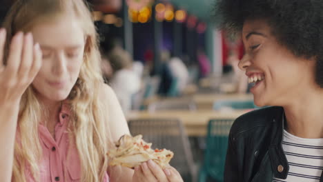 two-beautiful-women-eating-in-restaurant-best-friends-enjoying-delicious-meal-having-fun-hanging-out-socializing-together-on-weekend-4k