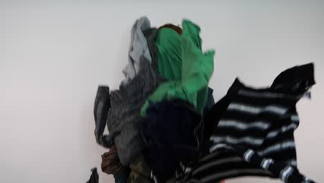 a man is hit by falling laundry seemingly overwhelmed emotionly