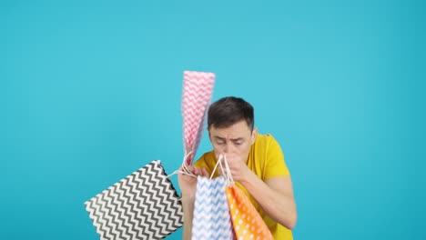 man holding shopping bags
