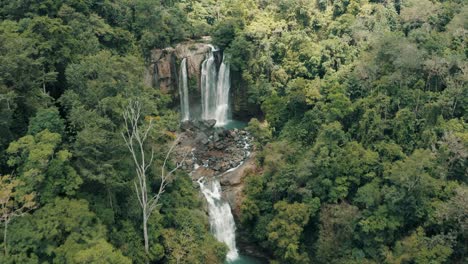 nauyaca waterfalls surrounded by lush greenery, costa rica