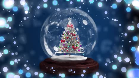 Animation-of-christmas-snow-globe-with-christmas-tree-on-blue-background